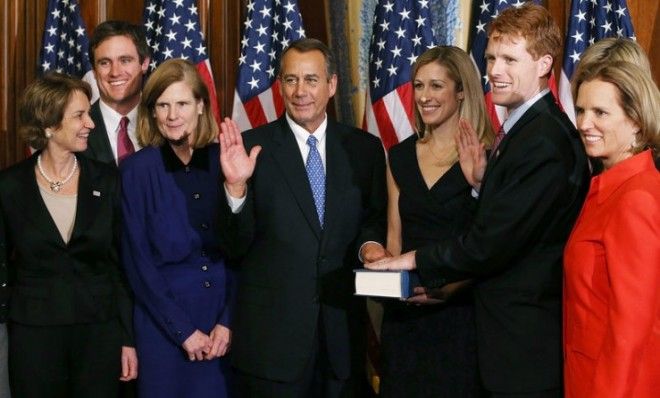 House Speaker John Boehner (R-Ohio) swears in U.S. Rep. Joseph Kennedy (D-Mass.) on Jan. 3 after again being voted speaker.