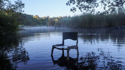 Six Dots Design metal chair in lake