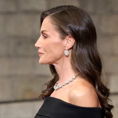 Queen Letizia wearing a black dress and diamonds