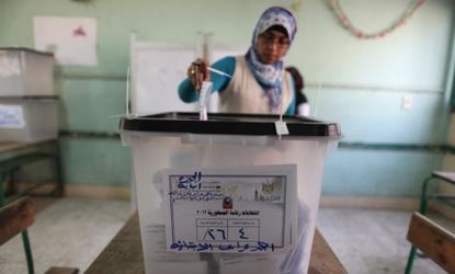 An Egyptian woman casts her ballot Wednesday