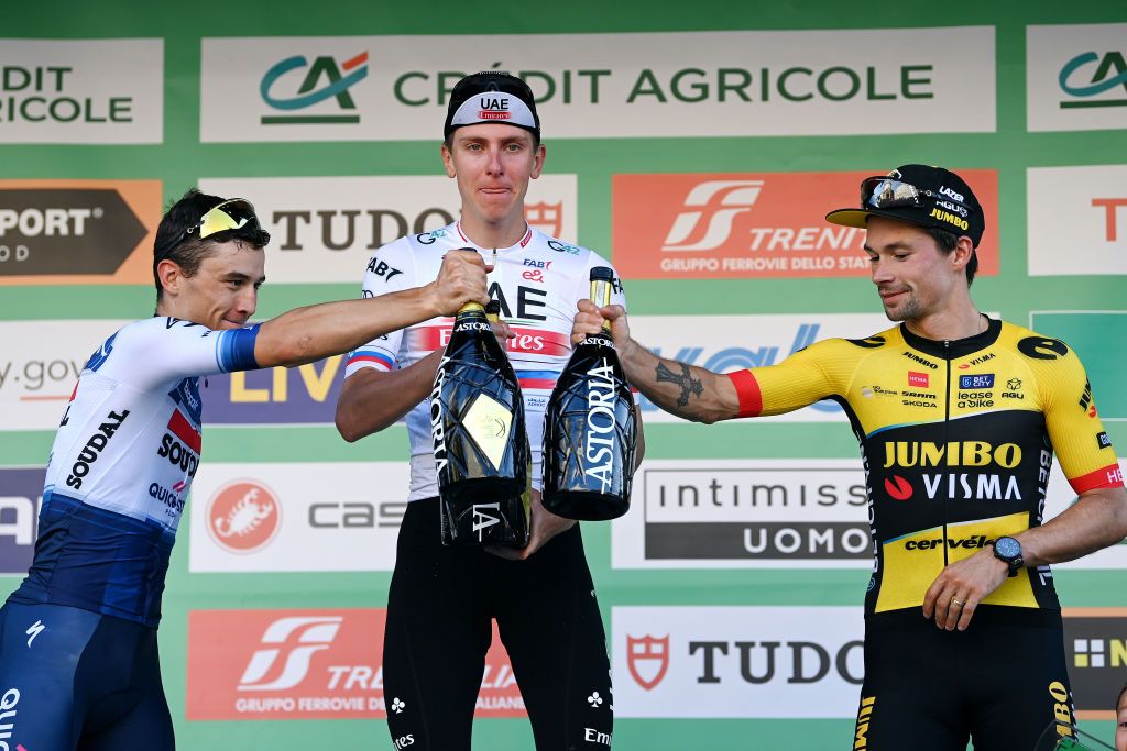 Cheers for second place Andrea Bagioli (Soudal QuickStep), winner Tadej Pogačar (UAE Team Emirates) and third place Primož Roglič (Jumbo-Visma)