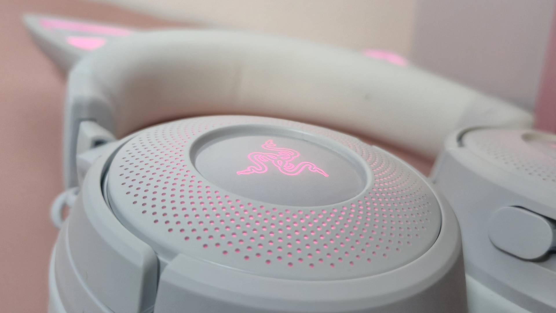 Close up of the RGB lighting on the white cups of the Kitty V3 Pro headset.