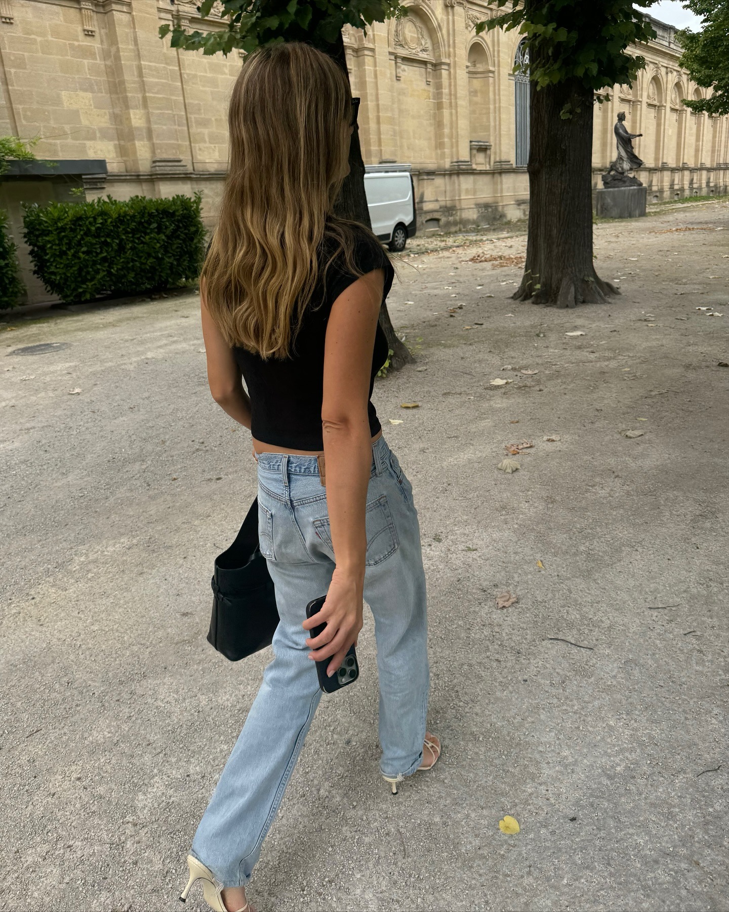 @annelauremais wearing a sleeveless black shirt with vintage Levi&#039;s jeans.