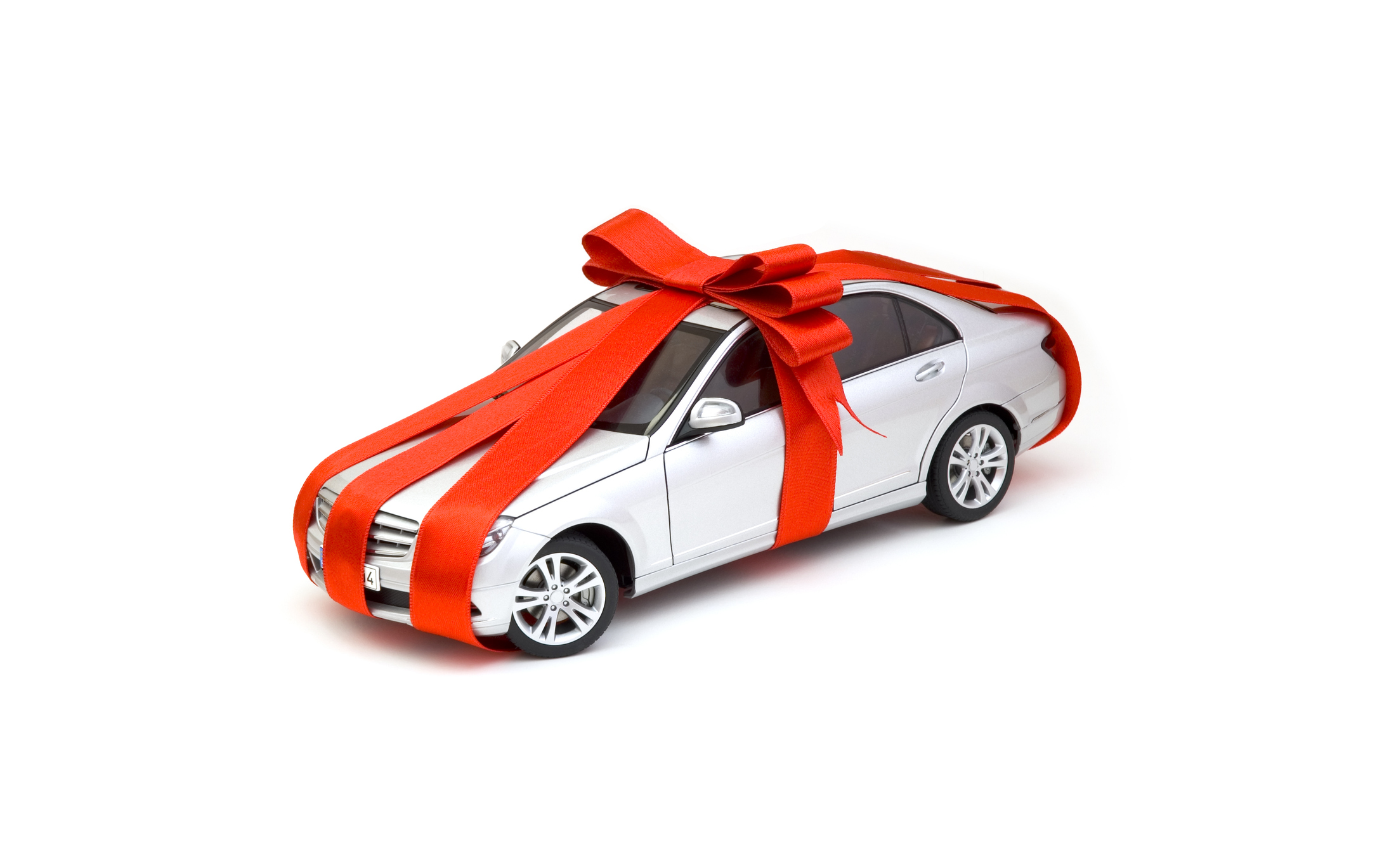 New car wrapped in a red bow