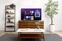 A press image showing one of Roku's Pro Series OLED TVs in a living room complete with plants and furniture