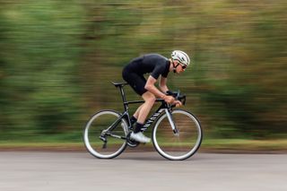 Image shows road cyclist riding