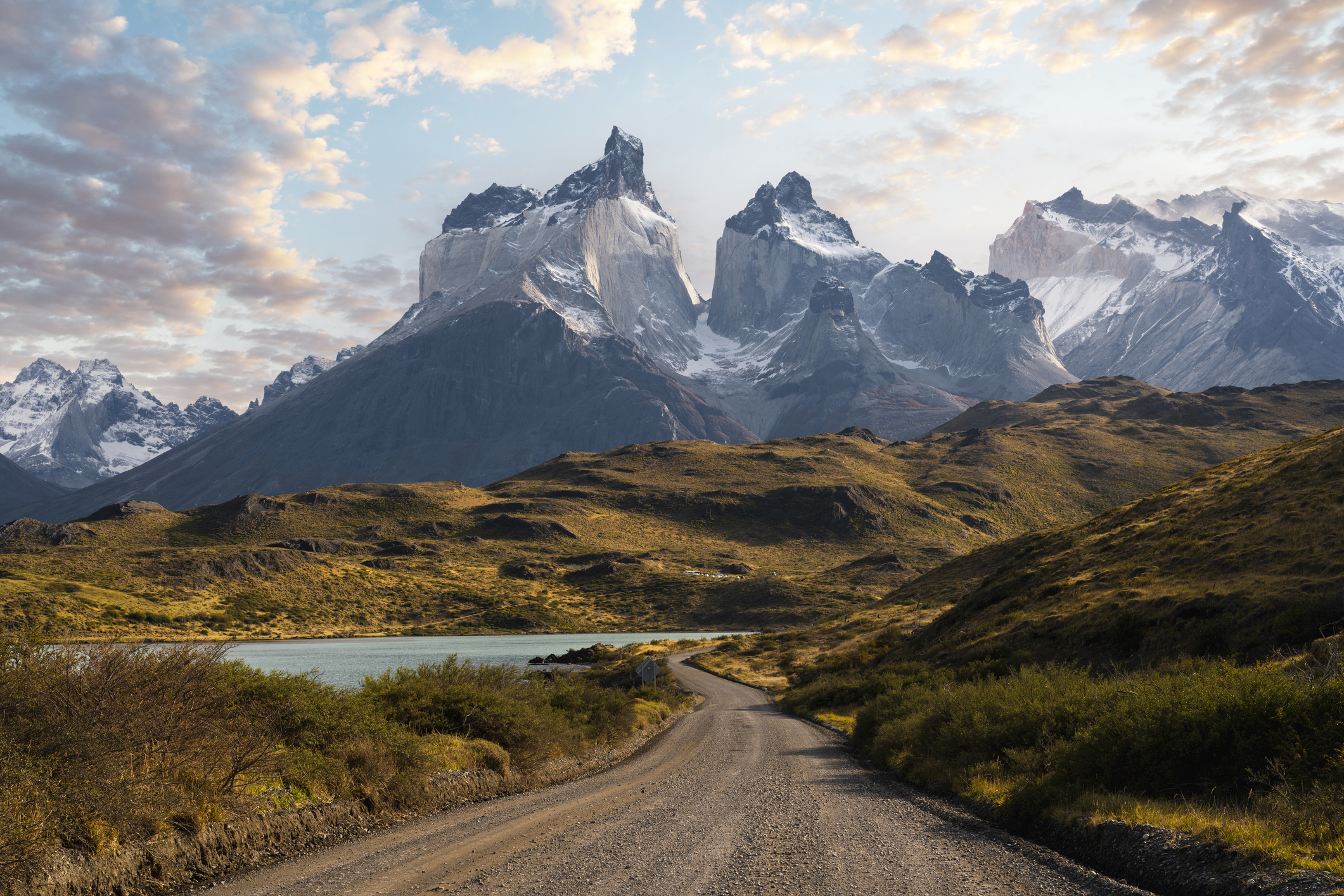 Coastal gravel road around Lake Pehoe and the Cordillera del Paine in the background.