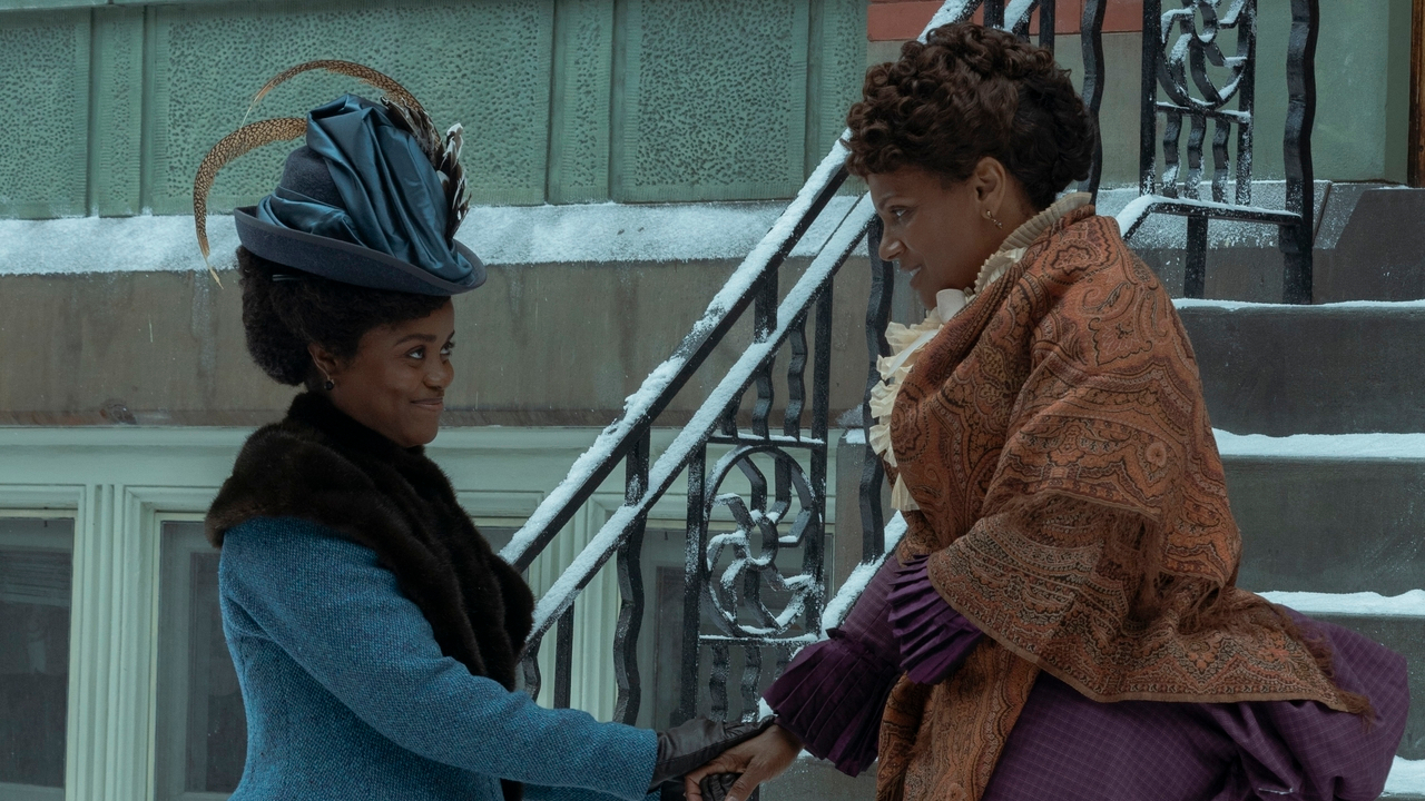 Denée Benton and Audra McDonald stand smiling in the snow in The Gilded Age S3 E1 - "Who Is In Charge Here?"