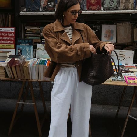 Woman in suede jacket and linen pants