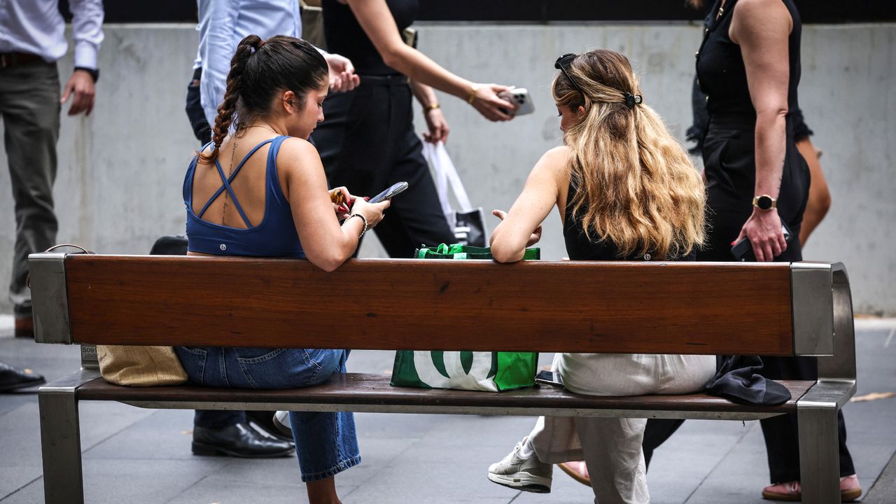 Teens in Sydney check their phones