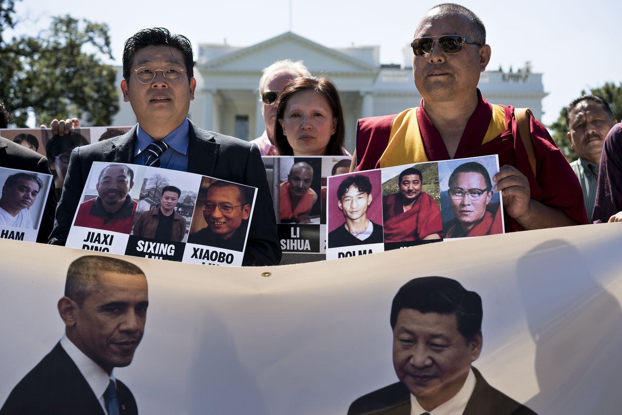 Protesters rally for Chinese political dissidents before President Xi Jinping&amp;#039;s state visit