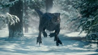 Blue the Velociraptor speeding towards the camera in the snow in Jurassic World Dominion.