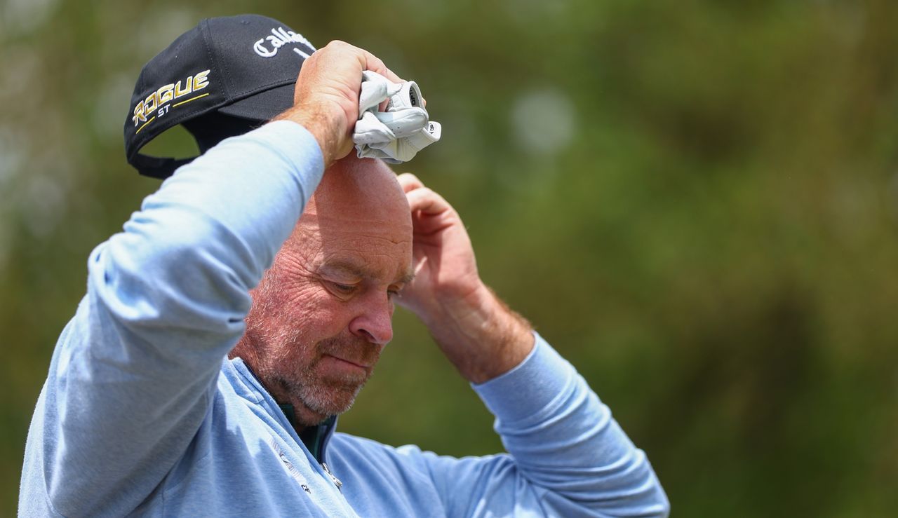 Thomas Bjorn readjusts his cap 