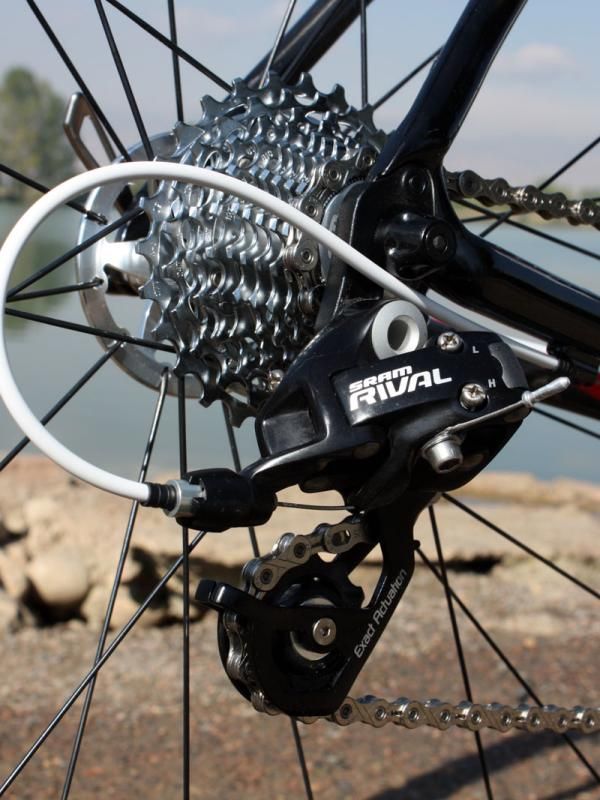 The Rival rear derailleur moves the KMC chain across a 12-27T SRAM PG-1070 cassette