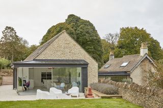 extension to cottage with stone cladding and sliding doors