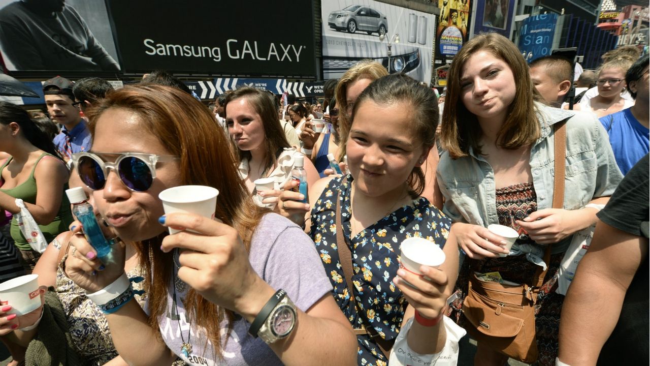 Hundreds of people rinse with mouthwash in Times Square June 25, 2013 during an event to promote Colgate-Palmolive Co.&amp;#039;s Colg