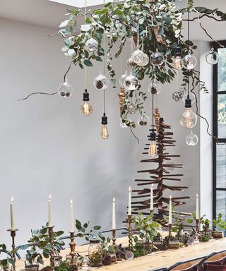 Festive dining table with festive focal point on overhead lighting