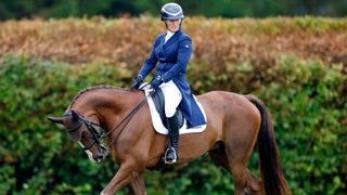 Zara Tindall warms up on her horse 'Class Affair' before competing in the dressage phase of the 2023 Festival of British Eventing