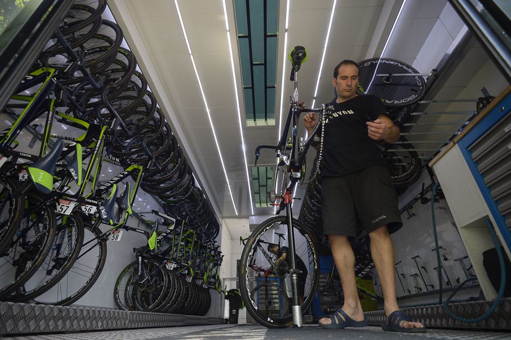 Movistar mechanics catch up on fine tuning the team's machines.