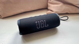 JBL Flip 6 speaker on window seat