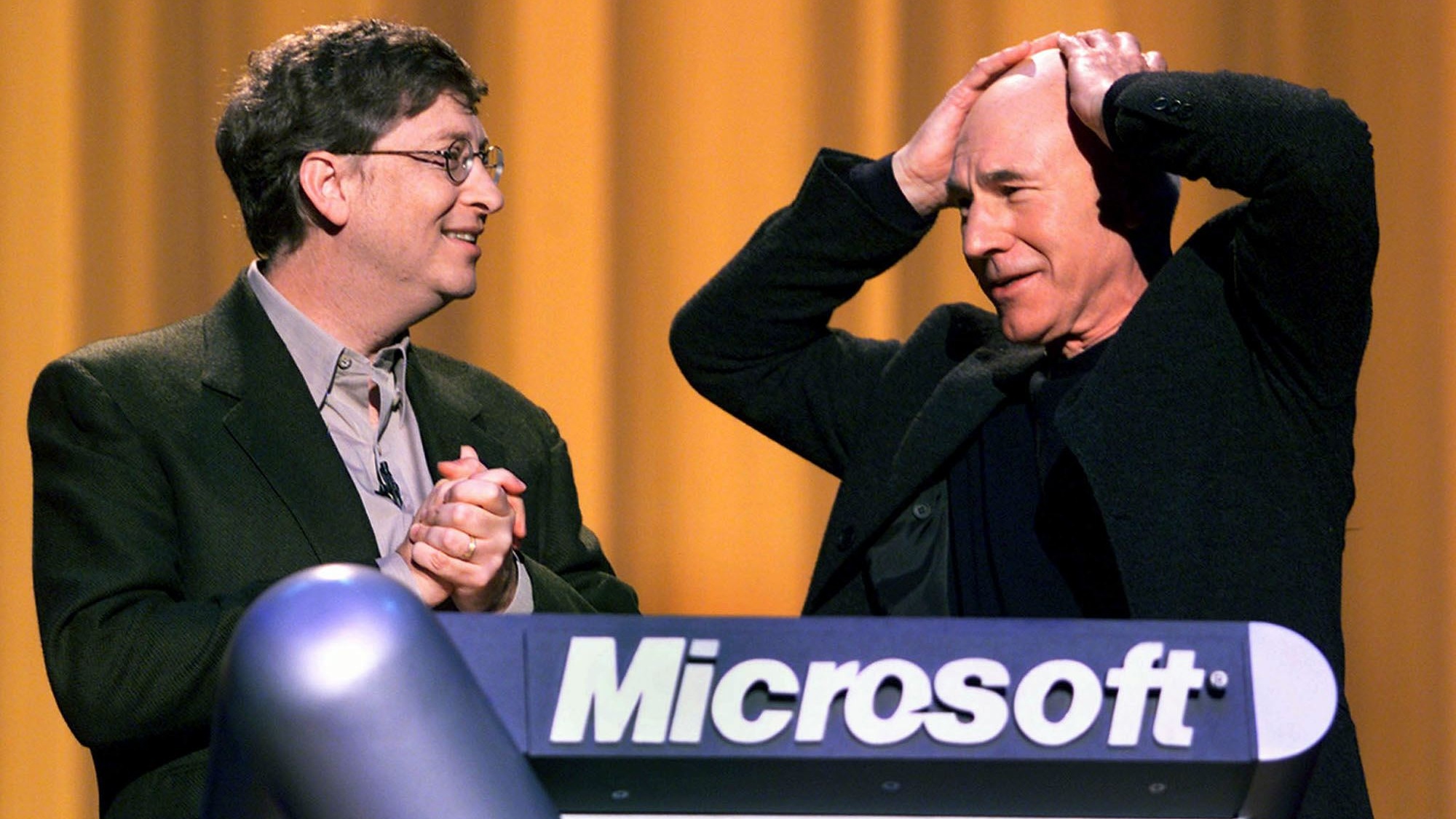 N364709 03: Actor Patrick Stewart talks with Bill Gates, co-founder and chairman of Microsoft, addresses the crowd during the launching of Windows 2000 in San Francisco on February 17, 2000.
