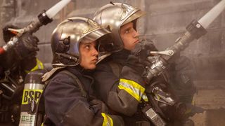 Corentin Fila and Megan Northam fighting the fire together in Notre-Dame