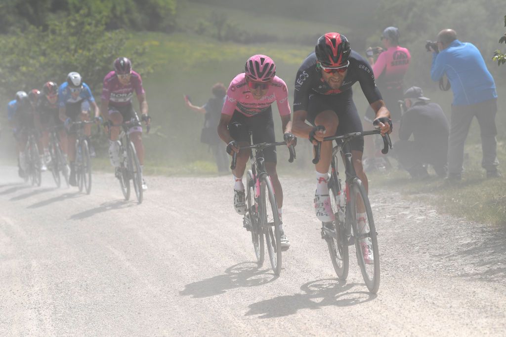 MONTALCINO ITALY MAY 19 Filippo Ganna of Italy and Team INEOS Grenadiers Egan Arley Bernal Gomez of Colombia and Team INEOS Grenadiers Pink Leader Jersey Peter Sagan of Slovakia and Team Bora Hansgrohe Purple Points Jersey during the 104th Giro dItalia 2021 Stage 12 a 162km stage from Perugia to Montalcino 554m Gravel Strokes Mud girodiitalia UCIworldtour Giro on May 19 2021 in Montalcino Italy Photo by Tim de WaeleGetty Images