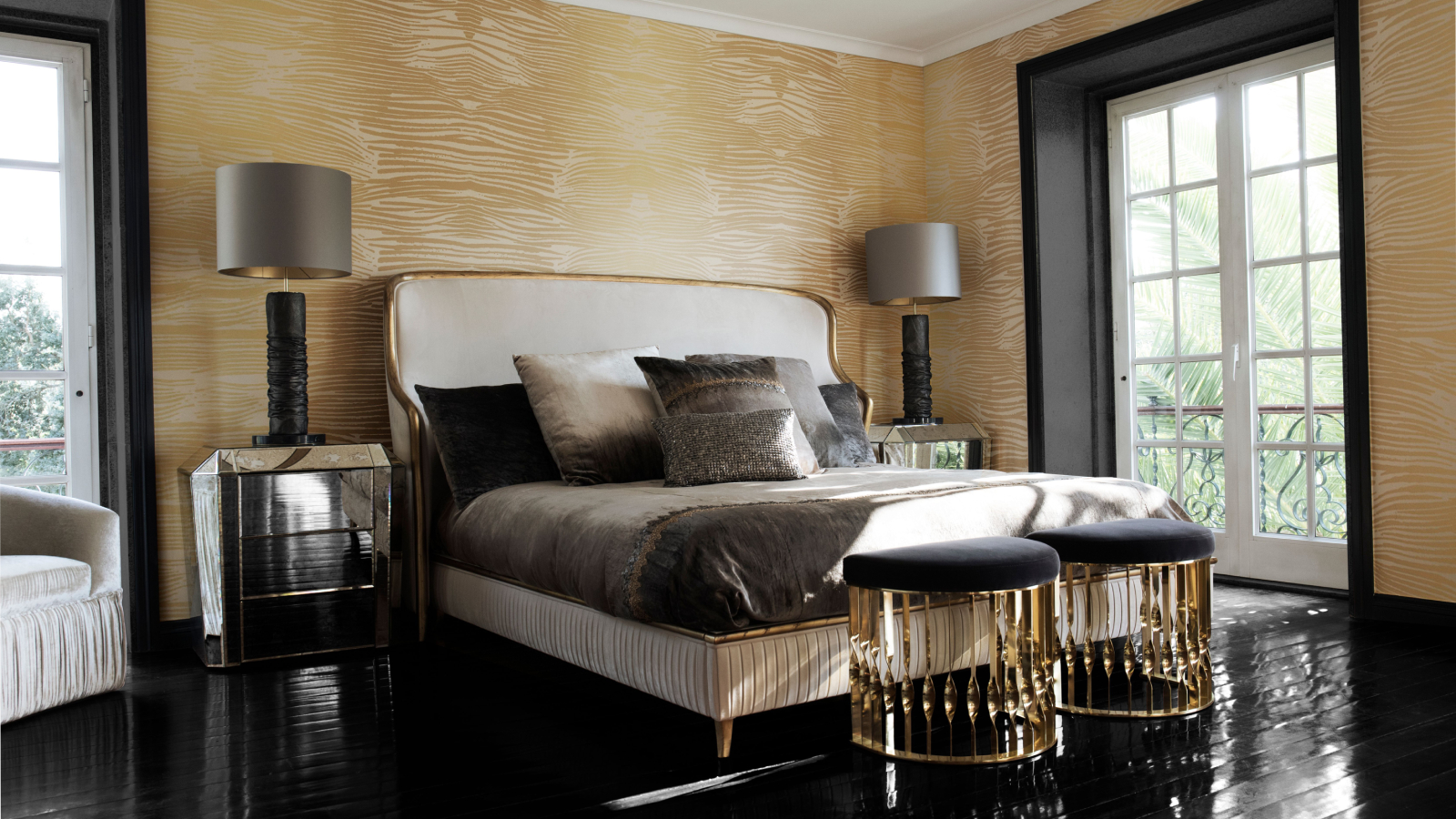 large bedroom with black gloss floor, large upholstered bed, black window reveals, gold metallic furniture