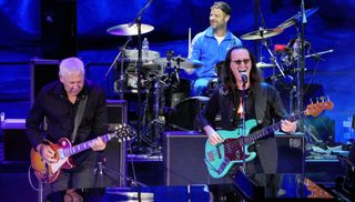 Alex Lifeson (far left) and Geddy Lee of the band Rush, and Matt Stone (background) perform at The South Park 25th Anniversary Concert at Red Rocks Amphitheatre on August 10, 2022 in Morrison, Colorado