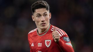 Close up of Harry Wilson in Wales kit with his thumb up