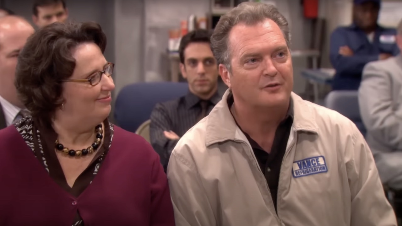 Bob Vance sitting next to Phyllis in the office