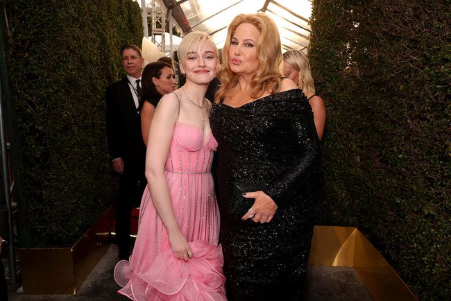 Julia Garner (l.), who won a Golden Globe for Best Supporting Actress in a TV Series for Ozark, and Jennifer Coolidge, winner for Best Supporting Actress in a Limited Series, Anthology or Movie made for TV for The White Lotus, arrive at the ceremony.
