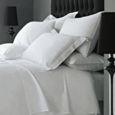 A set of white bed linens from Vision Linens.