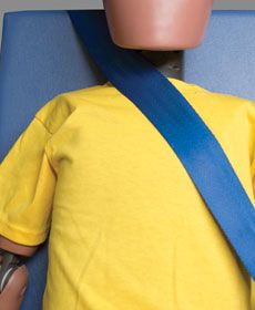 The shoulder belt should fit across the middle of the child's shoulder. This picture shows poor fit of the shoulder belt.