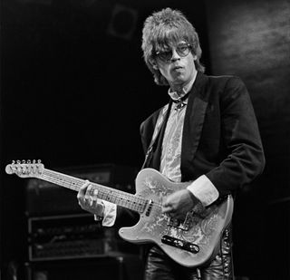 American Rock and New Wave musician Elliot Easton, of the band the Cars, as he plays guitar onstage, New York, New York, 1986.