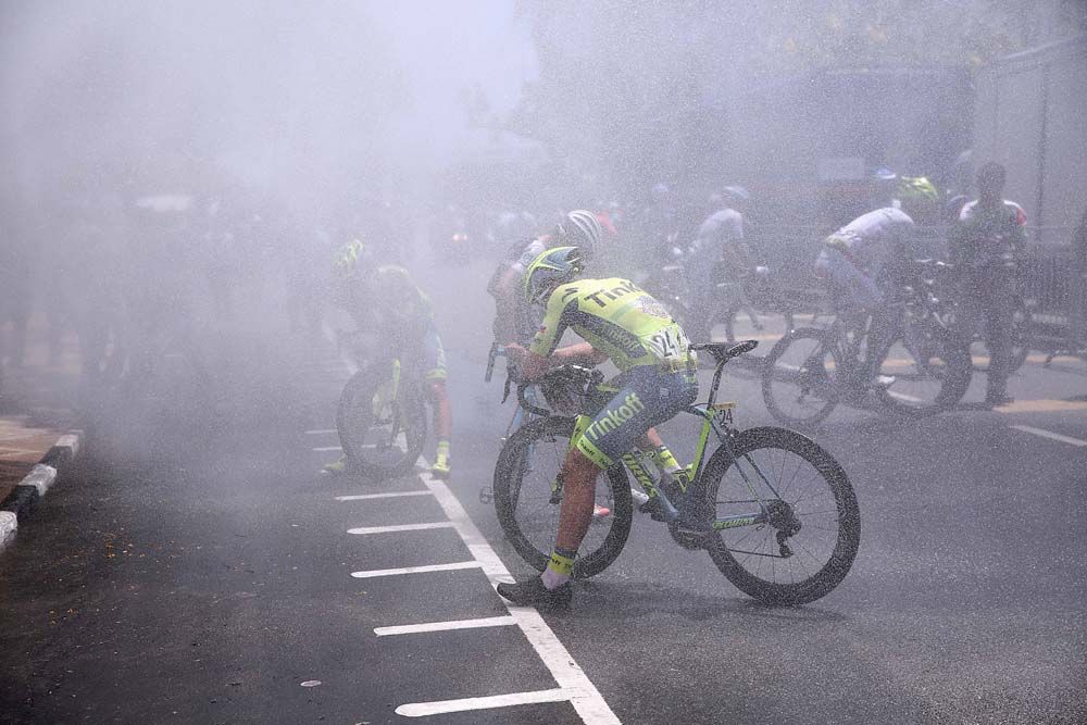 The water sprays help riders cool down post stage