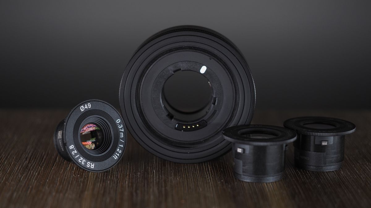 Samyang Remaster Slim module with lenses on a wooden surface
