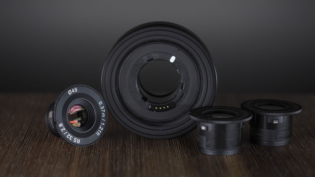 Samyang Remaster Slim module with lenses on a wooden surface