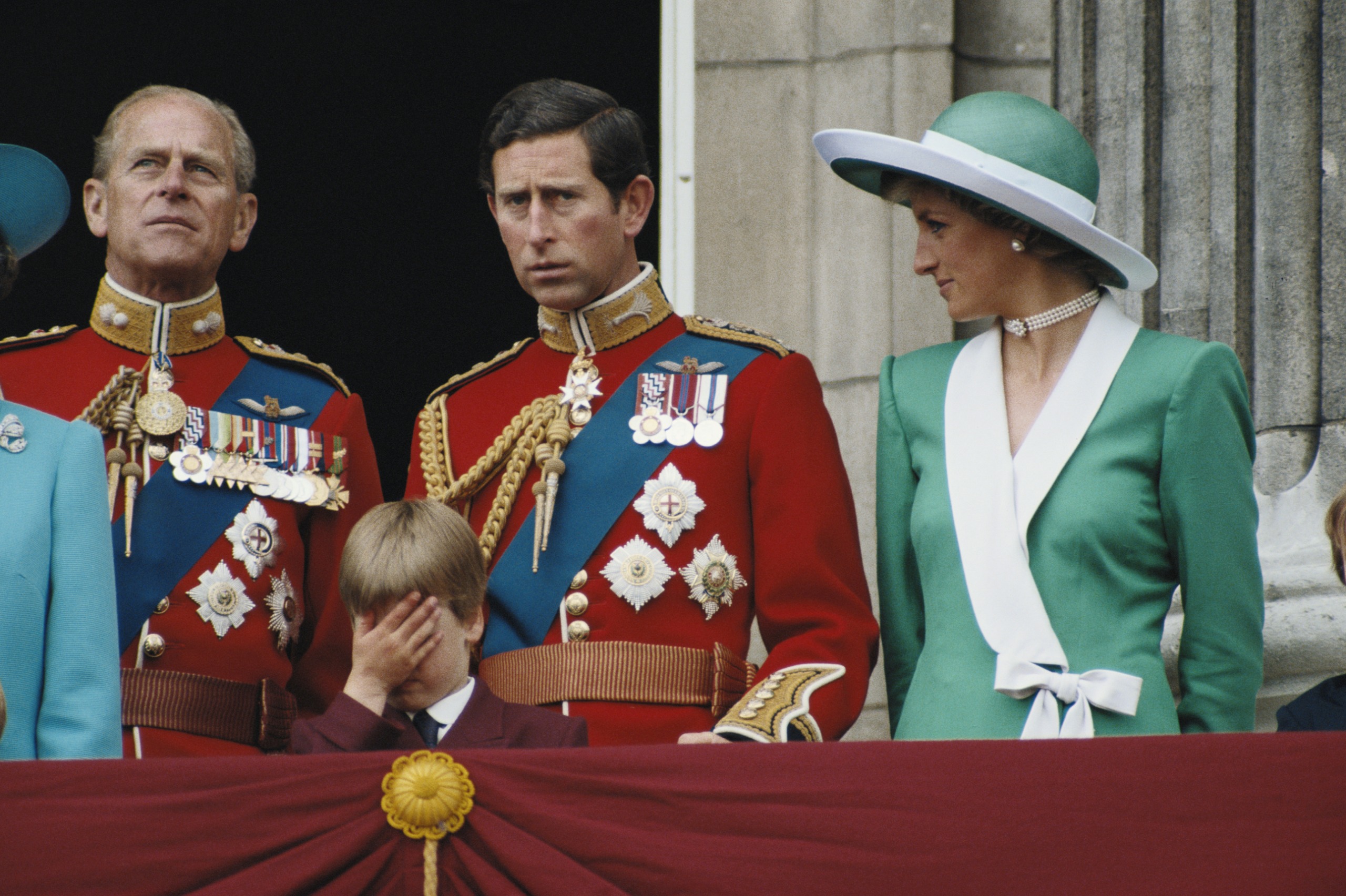 Prince Philip and King Charles wear suits and stand together