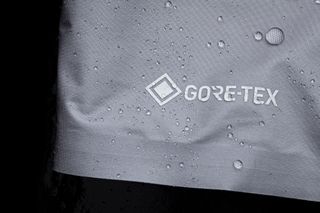 Close up of water beads on the Active Technology fabric of Castelli's Tempesta Lite jacket with the Gore-Tex branding