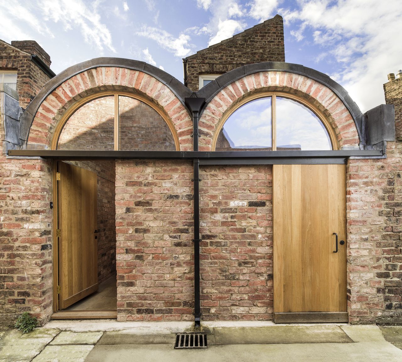 exterior of brick modern extension with oak doors