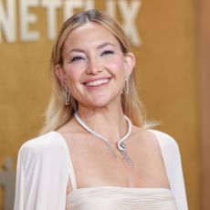 Kate Hudson wears a white Valentino caped dress at the 2026 SAG Awards a.k.a. The Actor Awards