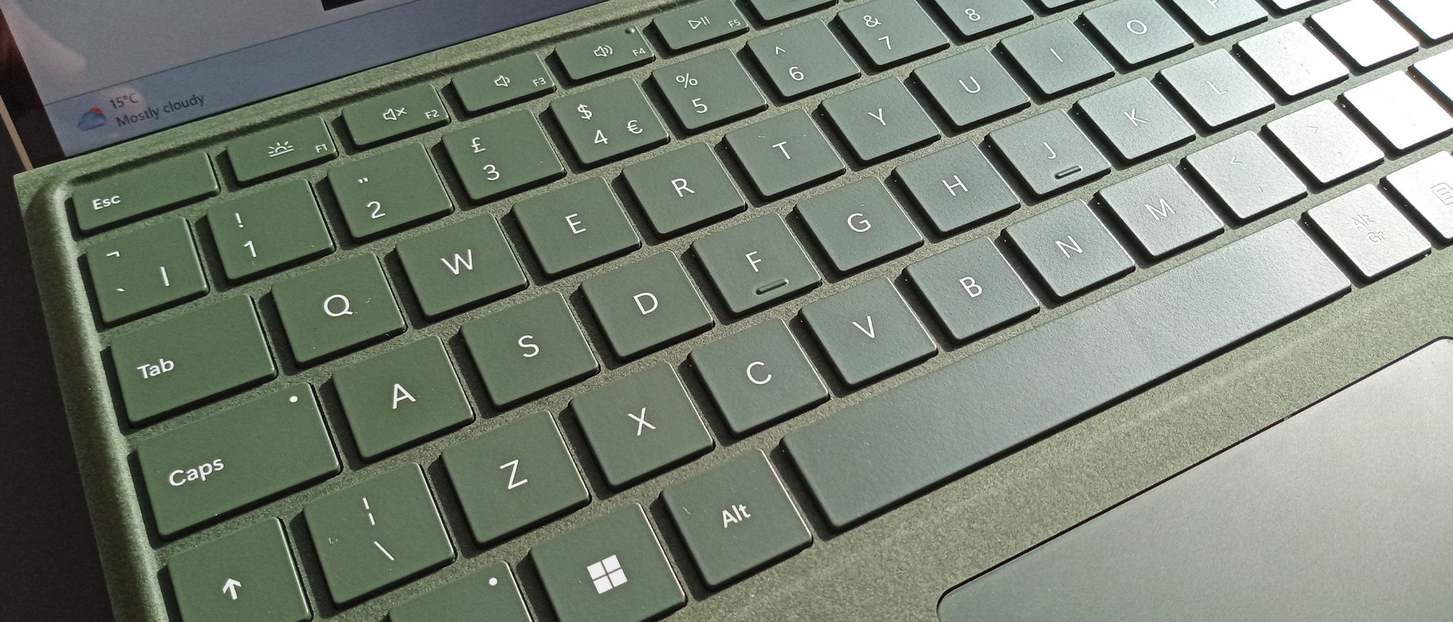 A close up of a green Microsoft Surface Pro 9 keyboard
