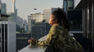 Lizzo on a balcony in Love, Lizzo 