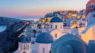 White houses with blue roofs in Santorini