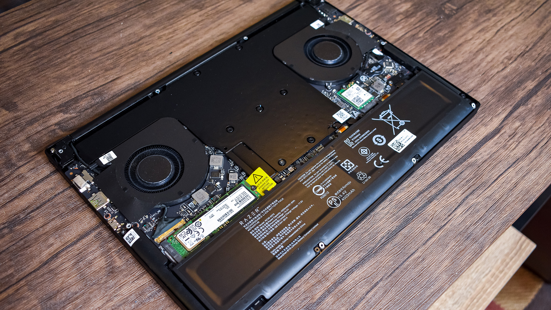 Razer Blade 14 inside, showing SSD, Wifi card and cooling solution.