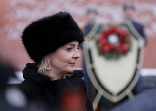British Foreign Secretary Liz Truss takes part in a wreath-laying ceremony at the Tomb of the Unknown Soldier by the Kremlin Wall in Moscow, Russia February 10, 2022