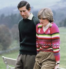 Prince Charles and Princess Diana sitting on a fence at Balmoral in 1981 