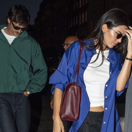 Jacob Elordi wearing a green windbreaker and Kendall Jenner wearing a cobalt blue button-down for a dinner out in London