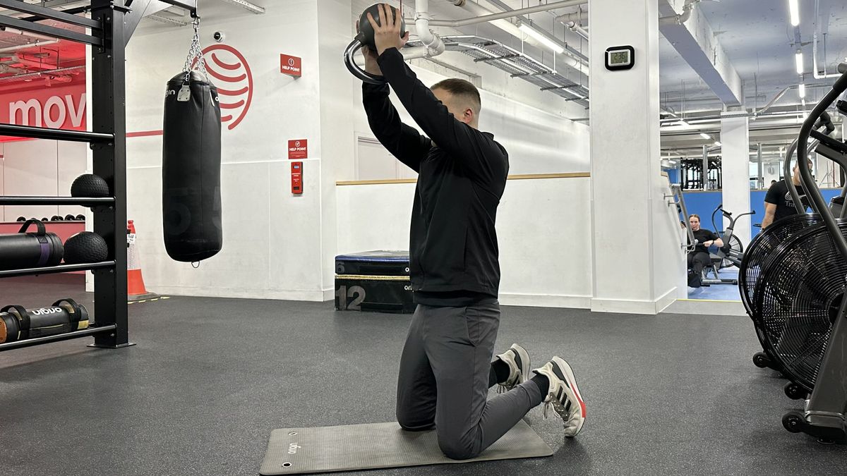 Ollie Thompson performing a kettlebell shoulder press